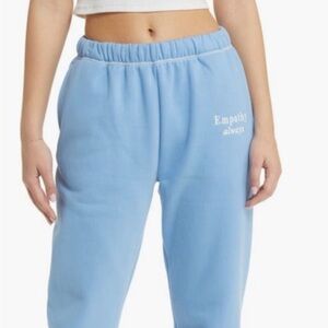 The Mayfair Group S/M Blue Sweatpants  'Empathy Always' baby blue white joggers